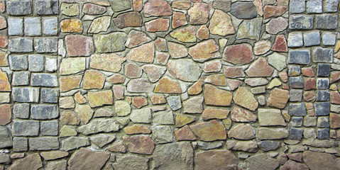 wall of granite boulders of different colors