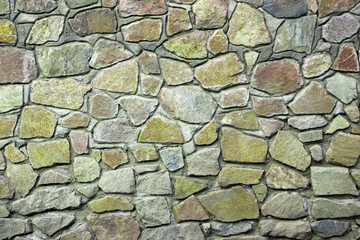 wall of granite boulders of different colors