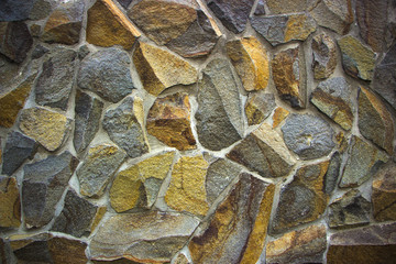 wall of granite boulders of different colors