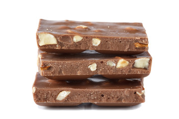 Close up of milk chocolate bars with hazelnuts