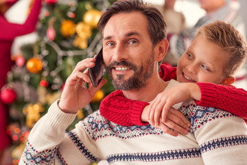 Joyful father celebrating holiday with son