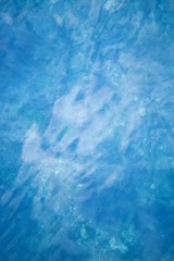 Water of sea ocean and pebbles on the bottom