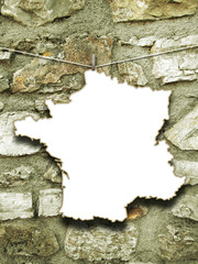 Close-up of one hanged France blank silhouette paper sheet frame against ancient stone wall background