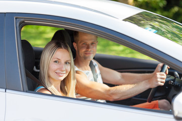 Young people enjoying a roadtrip in the car