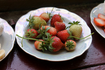 strawberries on a plate. summer dessert. red berry