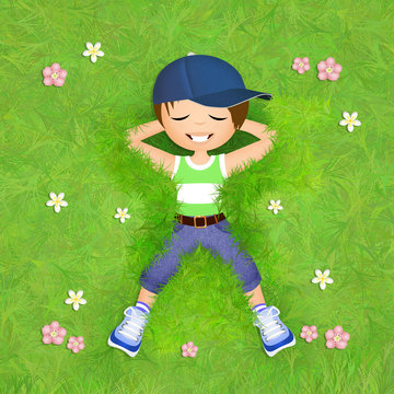little boy lying in the grass