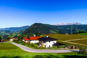 Fototapeta na wymiar Beautiful alpine summer landscape. Mountains and sun, blue sky,