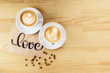 two mugs on a wood table