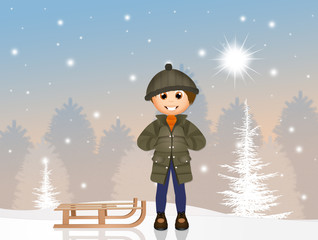Naklejka premium child with sleigh in the snow