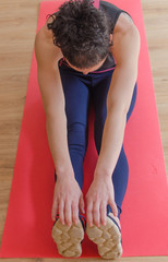 woman is making exercises in the hall