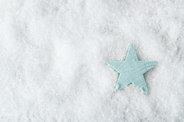 Pale Blue Star on White Snow from Above