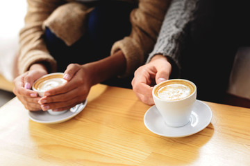 customers in the cafeteria with latte macchiato