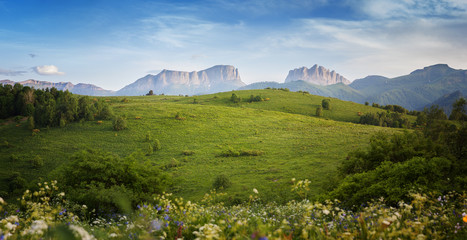 Fototapeta premium Mountains (Eastern and Western Acheshbok) under a blue sky with