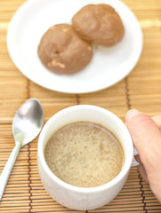 hot coffee and chocolate cookies on bamboo plate, vintage tone effect