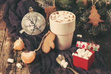 Mug filled with hot chocolate and marshmallows. Christmas background.