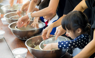 Asian children are cooking ice cream in cooking class