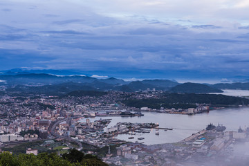 Sasebo city skyline at night from mount Yumihari in Nagasaki, Japan