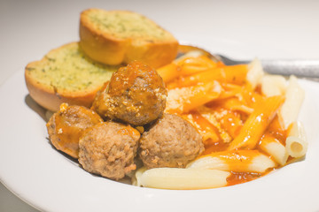 pasta with tomato sauce serve with meat ball and garlic bread