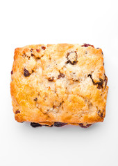 Fresh fruit scone with raisins on white