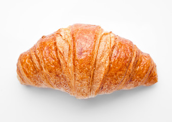 Fresh crispy croissant for breakfast on white