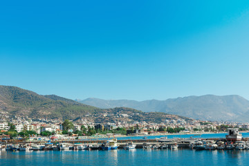Fototapeta na wymiar The port with ships near the shore of Antalya