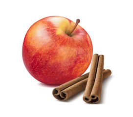 Whole red apple and cinnamon sticks isolated on white