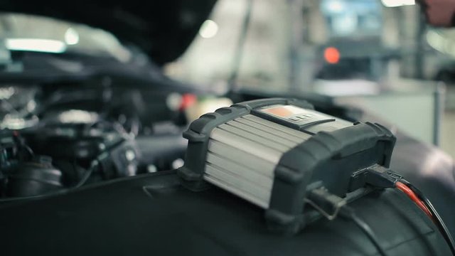 A man checks the power supply.