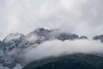 Misty mountain scene in Dolomites mountain Italy
