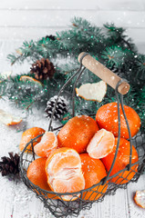 Fototapeta na wymiar new year composition in basket with mandarins