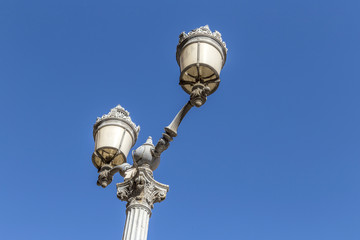 Fototapeta na wymiar old lantern downtown Aix en provence under blue sky