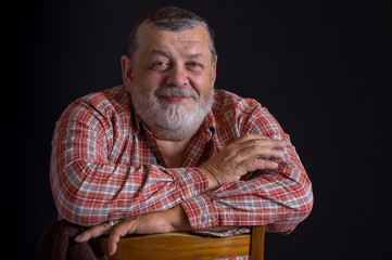 Portrait of happy Ukrainian peasant wearing checked shirt