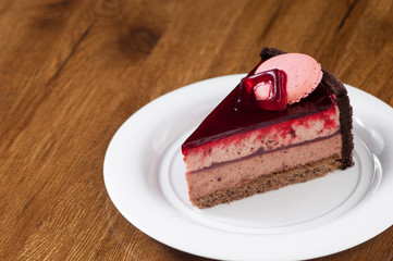 puff pastry in a round white plate on a wooden surface with reflection