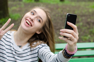 Young girl making selfie