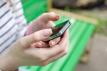Young woman using her phone