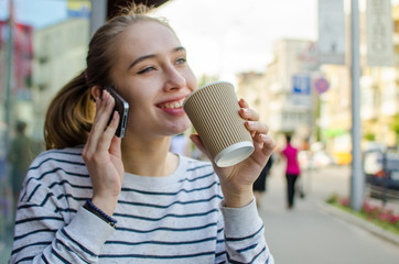 Young woman with tasty coffee 