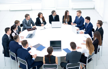 head of the company speaks to colleagues at conference