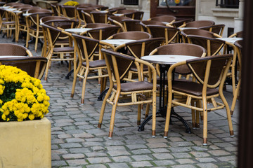 Empty tables of outdoor cafe in city center of Lviv, Ukraine in Europe