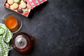 Tea cup, teapot and macaroons