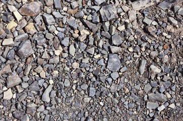 The texture of a rocky dirt road. Mountain road.
