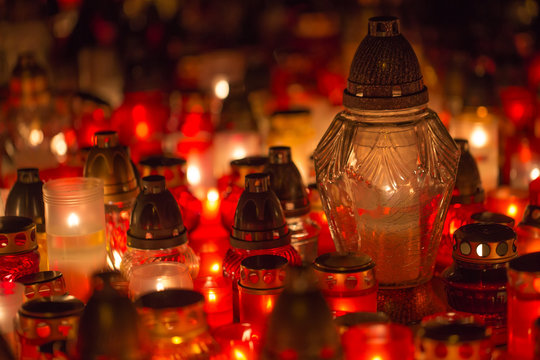 Many burning candles in the cemetery at night on the occasion memory of the deceased.Souls.