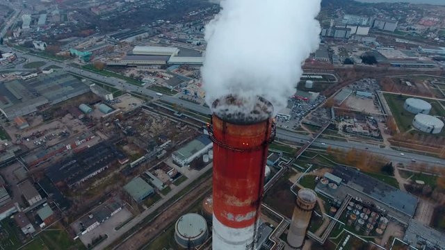 Coal fire power statio. Smokig pipe, close up. Aerial 4K