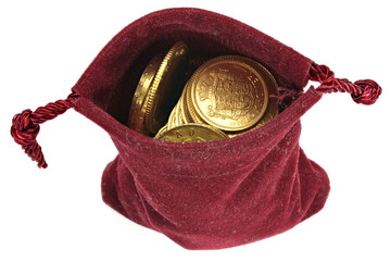 various European circulation gold coins from the 19th/20th century in a velvet purse isolated on...