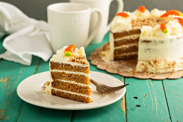 Slice of carrot cake with cream cheese frosting