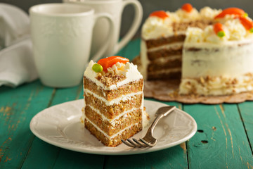 Slice of carrot cake with cream cheese frosting
