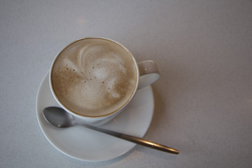 Coffee / Cappuccino, top view on white table