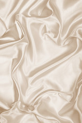 Smooth elegant golden silk as wedding background. In Sepia toned