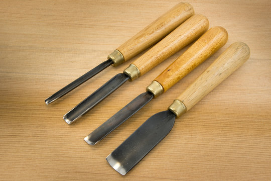 set of wood chisel for carving wood, sculpture tools on wooden b