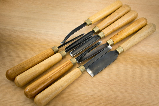 set of wood chisel for carving wood, sculpture tools on wooden b