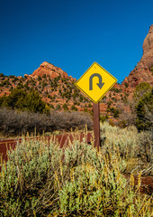 Sharp Curve sign on desert road in Utah