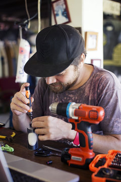 Man using screwdriver in the workshop